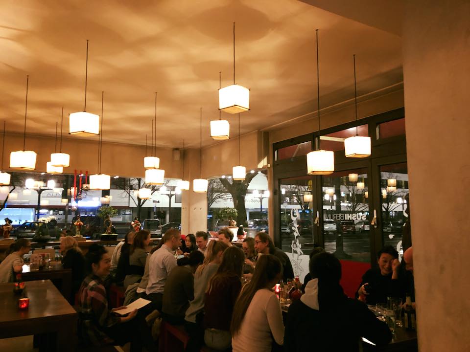 Customers and cubic lamps at Sushi Berlin