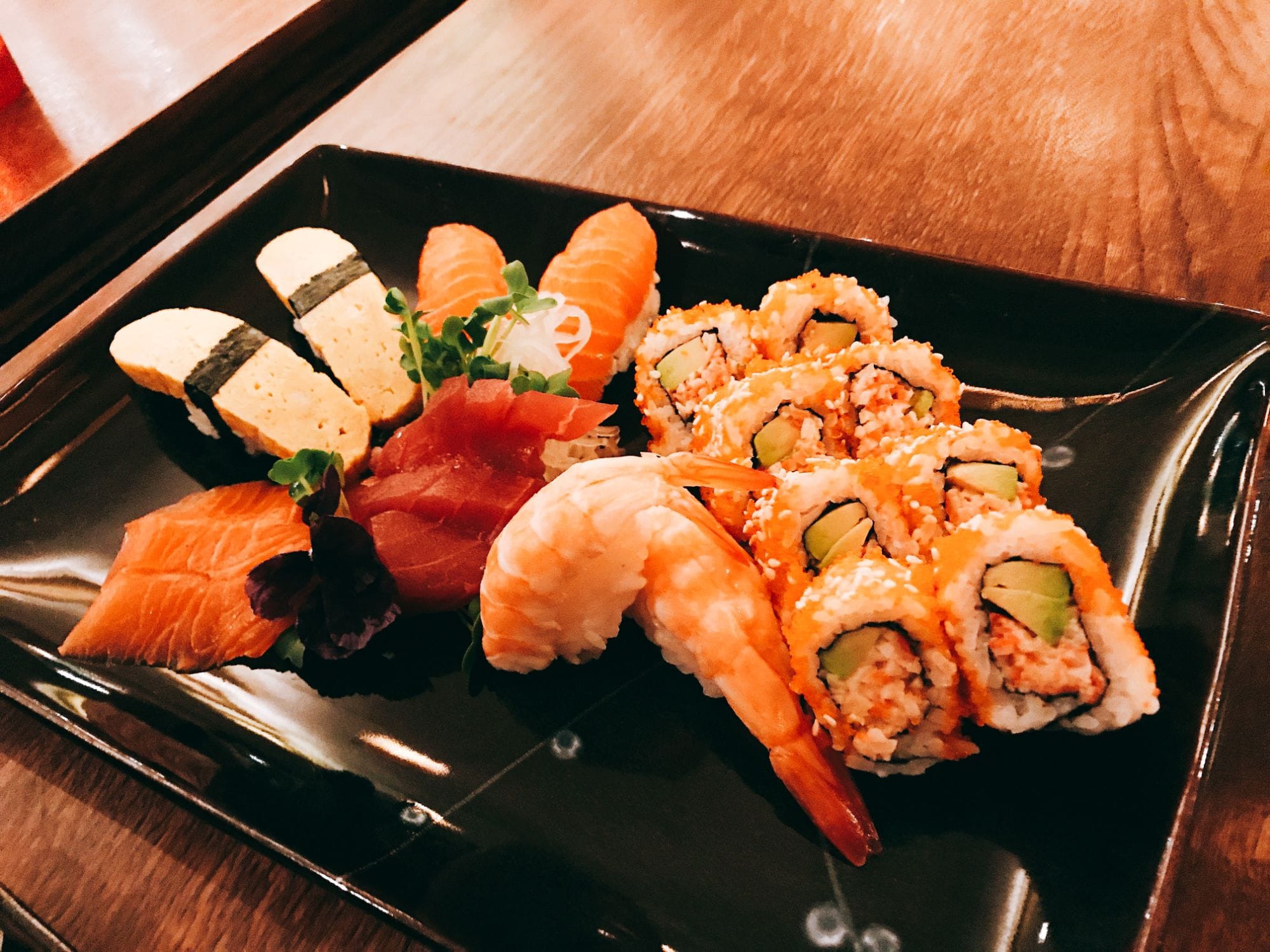 Sushi set with salmon sashimi, shrimp, egg and salmon nigiris at Sushi Berlin